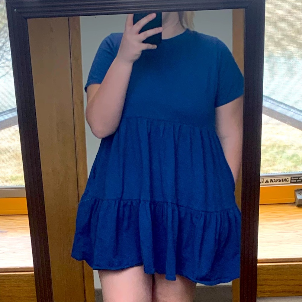 I’m selling a blue cotton dress that has Pockets.